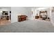 Spacious living room with hardwood floors, with seamless flow to office and seating areas at 11880 W 30Th Pl, Lakewood, CO 80215