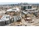 An aerial view shows the neighborhood, nearby buildings, and skyline views at 2736 N Clay St, Denver, CO 80211