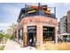 Charming three-story brick building with rooftop patio, housing Briar Common Brewery + Eatery at 2736 N Clay St, Denver, CO 80211