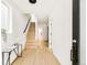 Bright foyer showcasing hardwood floors, stairs, and modern decor at 2736 N Clay St, Denver, CO 80211