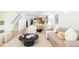 Inviting living area with modern furnishings, neutral tones, and seamless access to the dining and kitchen areas at 2736 N Clay St, Denver, CO 80211