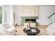 Stylish living room featuring a modern fireplace, comfortable seating, and contemporary decor, perfect for relaxation and entertaining at 2736 N Clay St, Denver, CO 80211