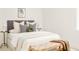 Bright main bedroom features neutral decor, soft lighting and a woven bench at 2736 N Clay St, Denver, CO 80211