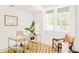 Bright office space with a clear window and a gold colored desk at 2736 N Clay St, Denver, CO 80211