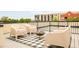 Rooftop deck featuring comfortable seating and stylish outdoor fire pit at 2736 N Clay St, Denver, CO 80211