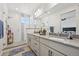 Bathroom showcases dual sinks, gray countertops, and glass enclosed shower with seat at 14952 Gladshine Dr, Parker, CO 80134