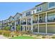 Street view of modern homes with balconies, offering a stylish and comfortable living experience at 14952 Gladshine Dr, Parker, CO 80134