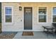 Inviting front entrance with a stylish door, sidelight windows and space for outdoor seating at 14952 Gladshine Dr, Parker, CO 80134