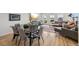 Open-concept living room and dining area with modern decor and natural light at 14952 Gladshine Dr, Parker, CO 80134