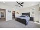 Spacious main bedroom with a walk in closet and dark furniture at 14952 Gladshine Dr, Parker, CO 80134