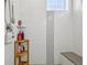 Stylish shower showcases modern tile design, corner seat, and sleek fixtures at 14952 Gladshine Dr, Parker, CO 80134