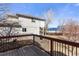 Backyard deck with views of the surrounding trees and landscaping at 8559 W 93Rd W Ct, Broomfield, CO 80021