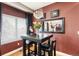 Dining area featuring hardwood floors and a modern chandelier at 8559 W 93Rd W Ct, Broomfield, CO 80021