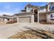 Charming home featuring a stone facade, attached garage and mature landscaping at 8559 W 93Rd W Ct, Broomfield, CO 80021