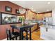 Charming kitchen features stainless steel appliances, light wood cabinetry, and an eat-in dining table at 8559 W 93Rd W Ct, Broomfield, CO 80021