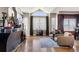 Spacious living area with high ceilings, a fireplace, and abundant natural light at 8559 W 93Rd W Ct, Broomfield, CO 80021