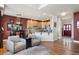 Open-concept living area with stylish furniture and views of the kitchen and entryway at 8559 W 93Rd W Ct, Broomfield, CO 80021