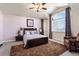 A main bedroom with a plush rug and a window for natural light at 8559 W 93Rd W Ct, Broomfield, CO 80021