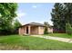 Single story home with a covered entrance and a spacious front yard at 10505 Lowry Pl, Aurora, CO 80010