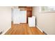 Laundry room features hardwood floors and a convenient washer near built-in storage at 10505 Lowry Pl, Aurora, CO 80010