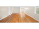 Bright living room with beautiful hardwood flooring and neutral walls at 10505 Lowry Pl, Aurora, CO 80010