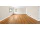 Bright living room featuring hardwood floors and natural lighting from the window at 10505 Lowry Pl, Aurora, CO 80010
