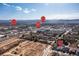 Aerial view highlighting a new construction site, nearby amenities, and mountain views at 5211 Routt Ct, Arvada, CO 80002