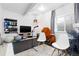Basement exercise room features exercise equipment and natural light at 5211 Routt Ct, Arvada, CO 80002