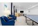 Spacious game room featuring a ping pong table and bar at 5211 Routt Ct, Arvada, CO 80002