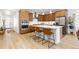 Spacious kitchen with stainless steel appliances, light countertops, and a large island with seating at 5211 Routt Ct, Arvada, CO 80002
