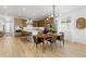 Open concept living space with modern kitchen, dining area, and ample natural light at 5211 Routt Ct, Arvada, CO 80002