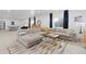 Spacious living room with a sectional couch and large windows providing natural light at 5211 Routt Ct, Arvada, CO 80002