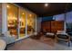 Cozy covered patio with comfortable seating and seamless access to the indoors at 5211 Routt Ct, Arvada, CO 80002