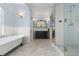 Bathroom with clawfoot tub, subway tile, and glass shower at 930 E 7Th Ave, Denver, CO 80218