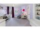 Spacious bedroom with purple walls and plenty of natural light at 930 E 7Th Ave, Denver, CO 80218