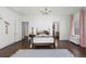 Charming bedroom with hardwood floors and a beautiful chandelier at 930 E 7Th Ave, Denver, CO 80218