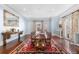 Formal dining room with hardwood floors, large windows, and elegant chandelier at 930 E 7Th Ave, Denver, CO 80218