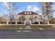 Grand two-story home with a red tile roof and gated entryway at 930 E 7Th Ave, Denver, CO 80218