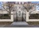 Elegant home exterior with iron gate and stone steps at 930 E 7Th Ave, Denver, CO 80218