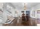 Bright foyer with hardwood floors, grand staircase, and antique table at 930 E 7Th Ave, Denver, CO 80218