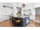 Gourmet kitchen with large island, granite counters, and stainless steel appliances at 930 E 7Th Ave, Denver, CO 80218