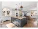 Open kitchen boasts a large island, custom cabinetry, and hardwood floors at 930 E 7Th Ave, Denver, CO 80218