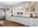 Modern kitchen with white cabinets, granite countertops, and stainless steel appliances at 930 E 7Th Ave, Denver, CO 80218
