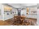 Kitchen features white cabinetry, a farmhouse table, and built-in hutch at 930 E 7Th Ave, Denver, CO 80218