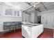 Functional laundry room featuring a utility sink, white cabinets and appliances at 930 E 7Th Ave, Denver, CO 80218