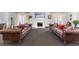 Spacious living room with leather sofas, fireplace, and large windows at 930 E 7Th Ave, Denver, CO 80218