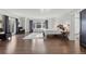 Spacious main bedroom with hardwood floors and access to a balcony at 930 E 7Th Ave, Denver, CO 80218