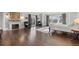 Main bedroom featuring hardwood floors, fireplace and ample natural light at 930 E 7Th Ave, Denver, CO 80218