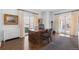 Home office with hardwood floors, antique desk, and large windows at 930 E 7Th Ave, Denver, CO 80218