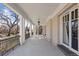 Covered porch with white columns and tile flooring at 930 E 7Th Ave, Denver, CO 80218